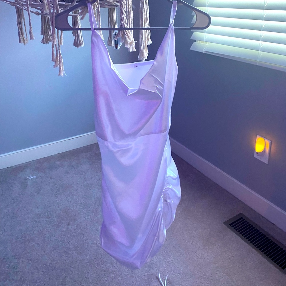 This is a white silky tie dress.